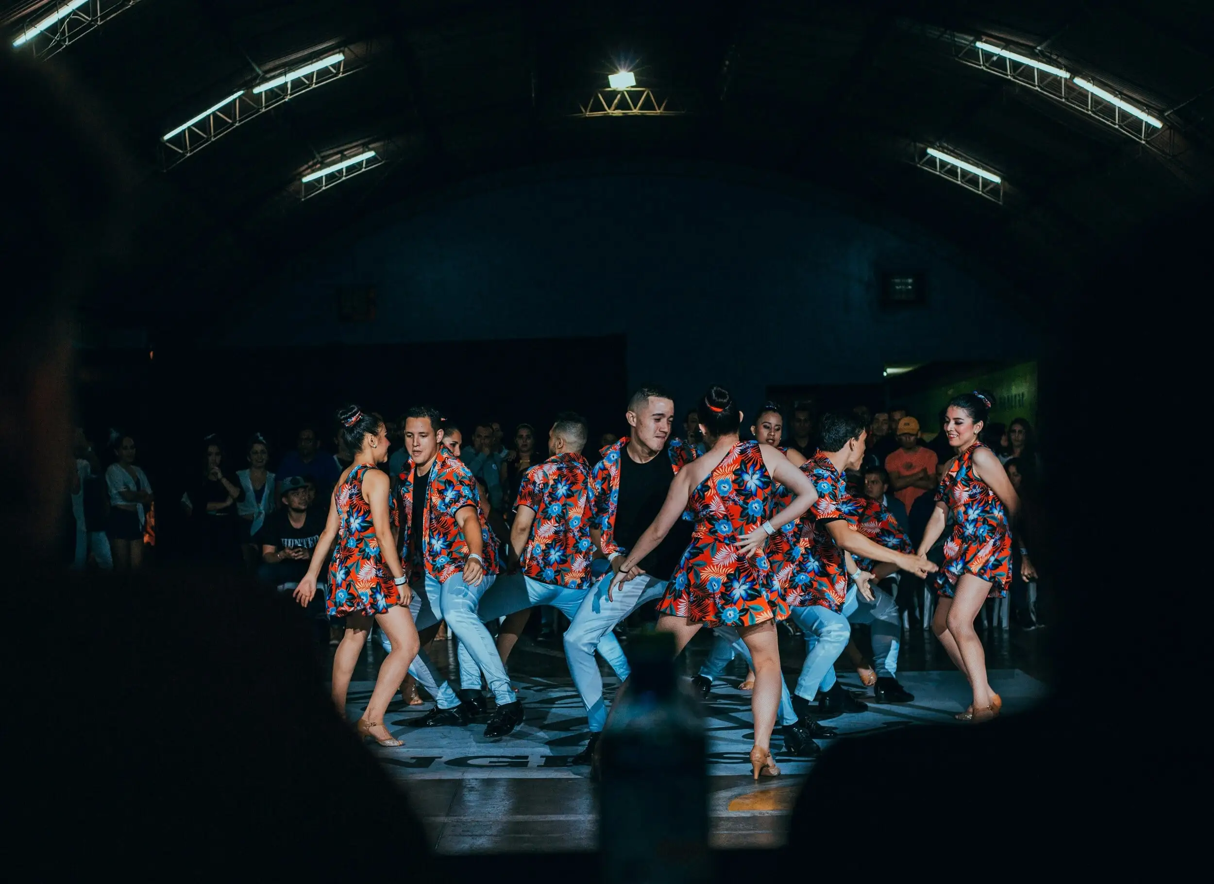 People dancing with flowered prints